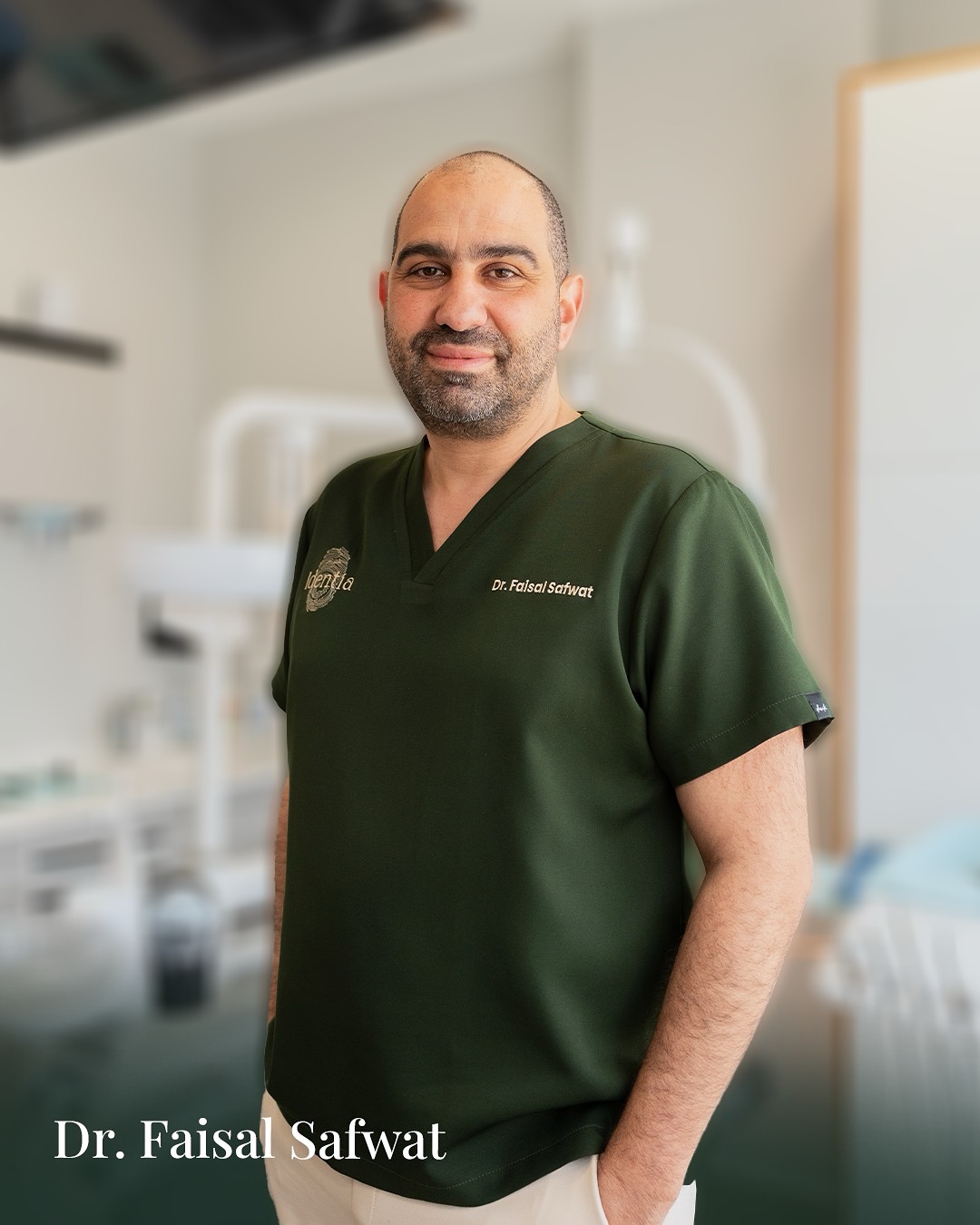 Portrait of Dr. Faisal Safwat in green Identia scrubs in the treatment room.